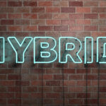 HYBRID – fluorescent Neon tube Sign on brickwork